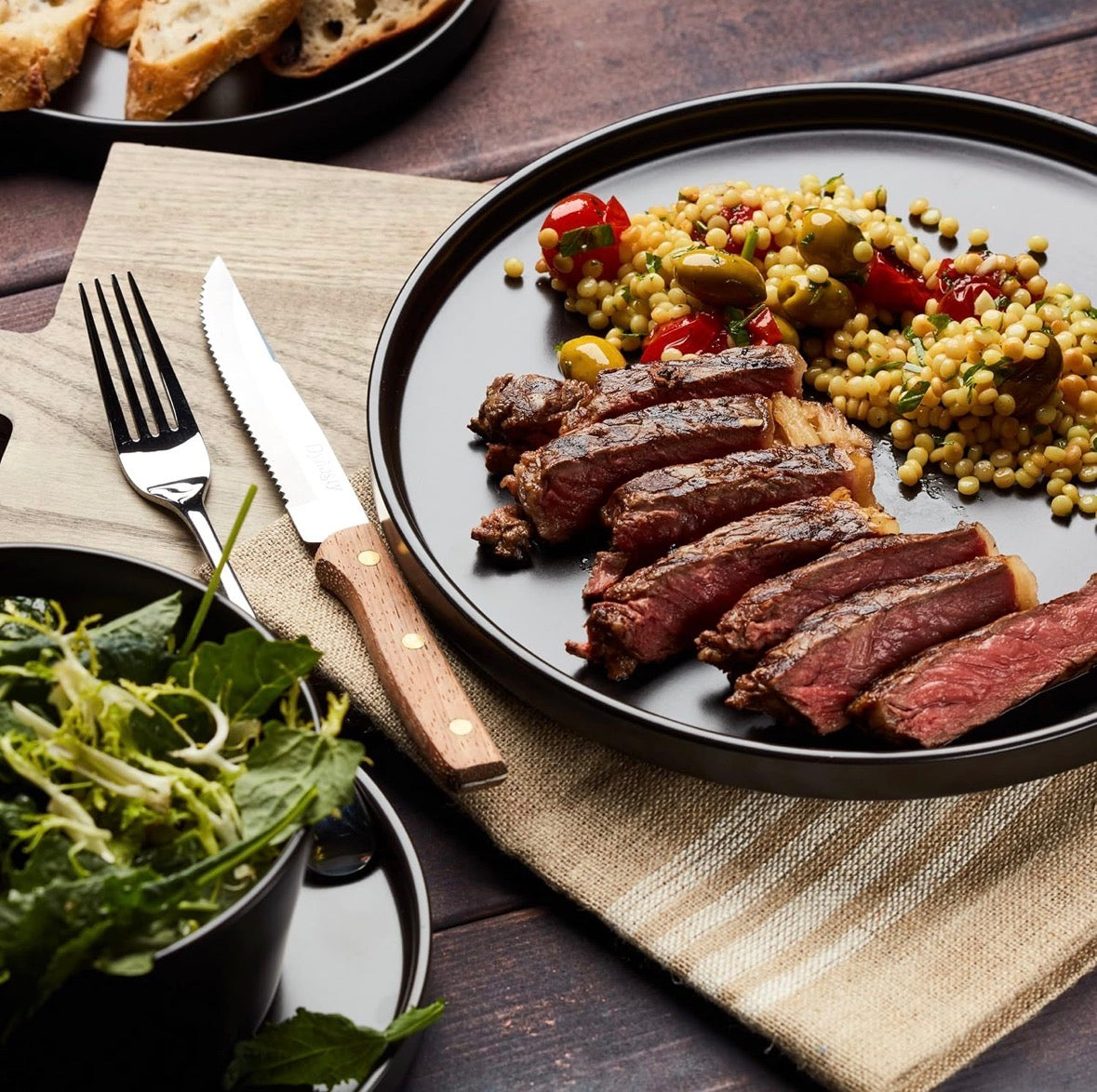 Stone Lain Celina 16-Piece Stoneware Round Dinnerware Set, Service for 4 - Black Matte Plates, Bowls and Dish, Service for 4 – Minimalist Round Style, Microwave & Dishwasher Safe